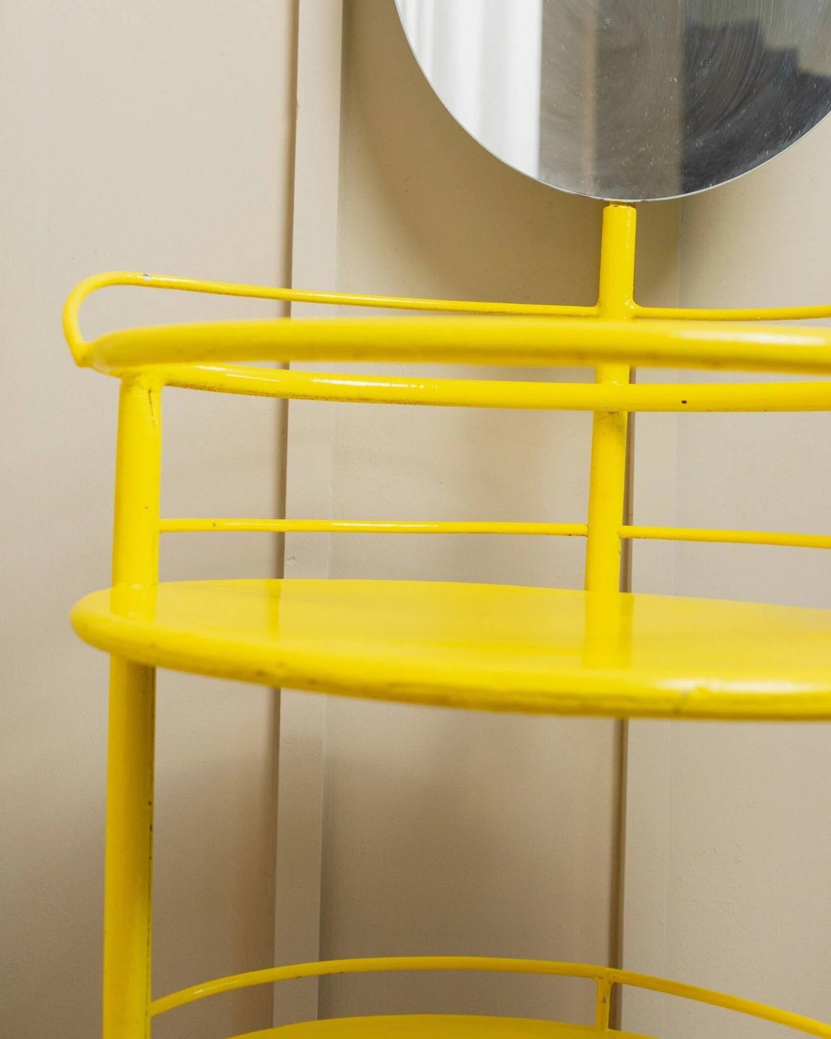 Yellow metal side table with swiveling oval mirror and two tray shelves, vintage 1960s Italy