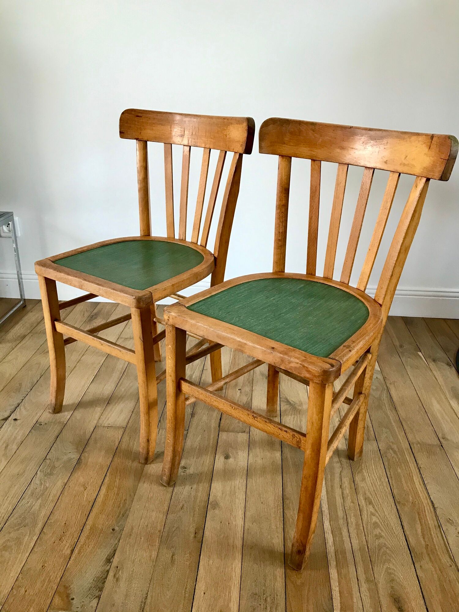 Pair of bistro chairs in light curved wood and green seat 1950s