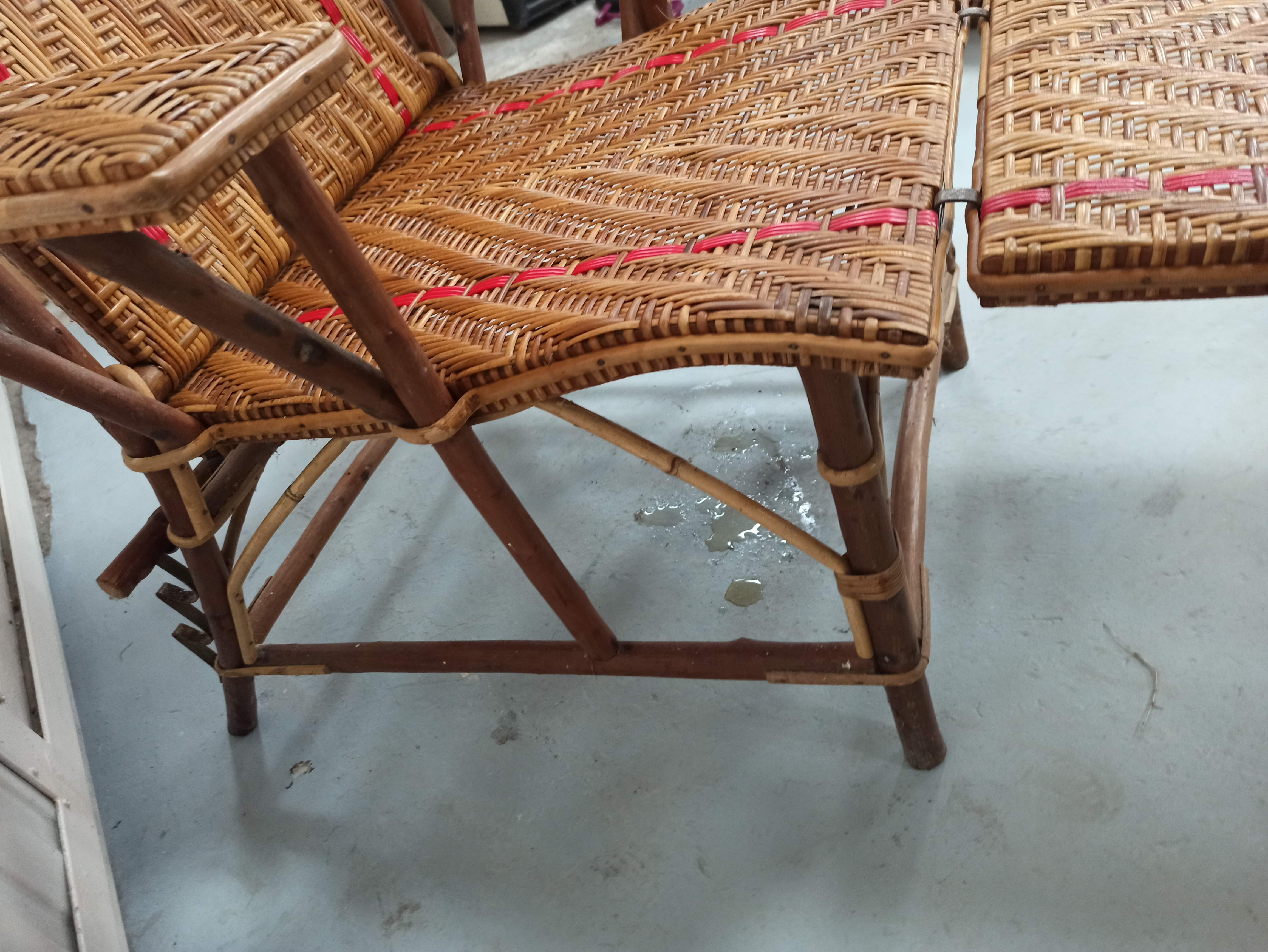 Sunbathing sunbathing in wicker rattan wood deckchair red lounger