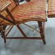 Sunbathing sunbathing in wicker rattan wood deckchair red lounger