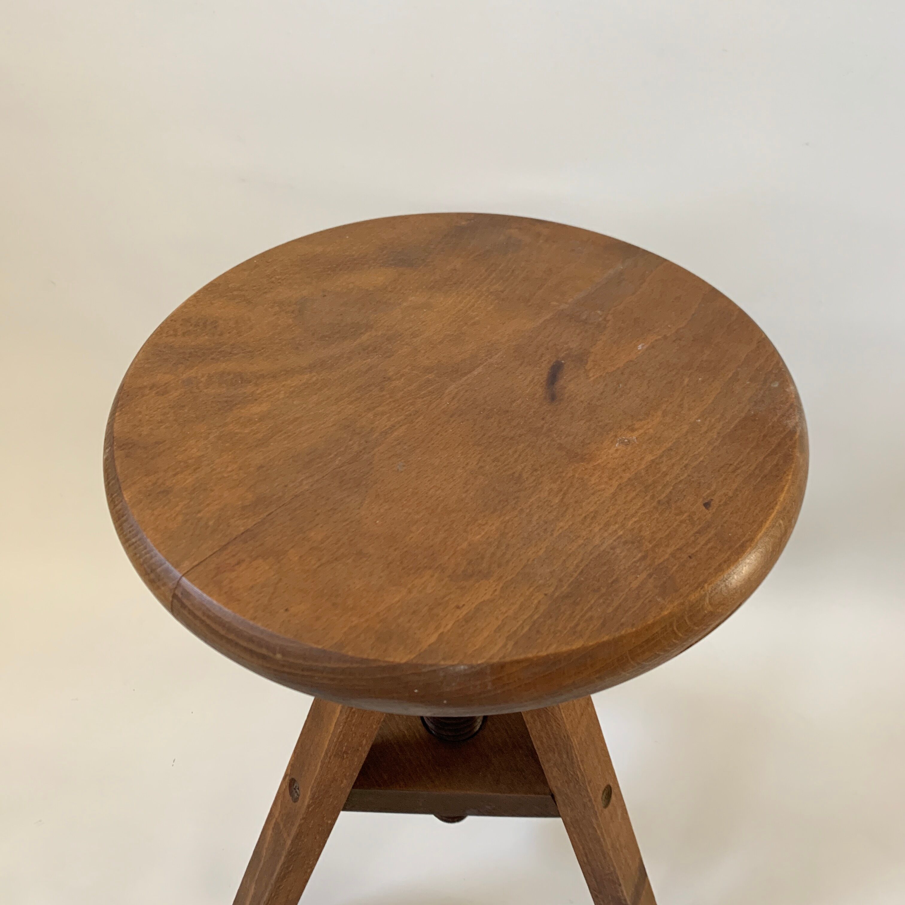 Wooden tripod stool with vintage screw