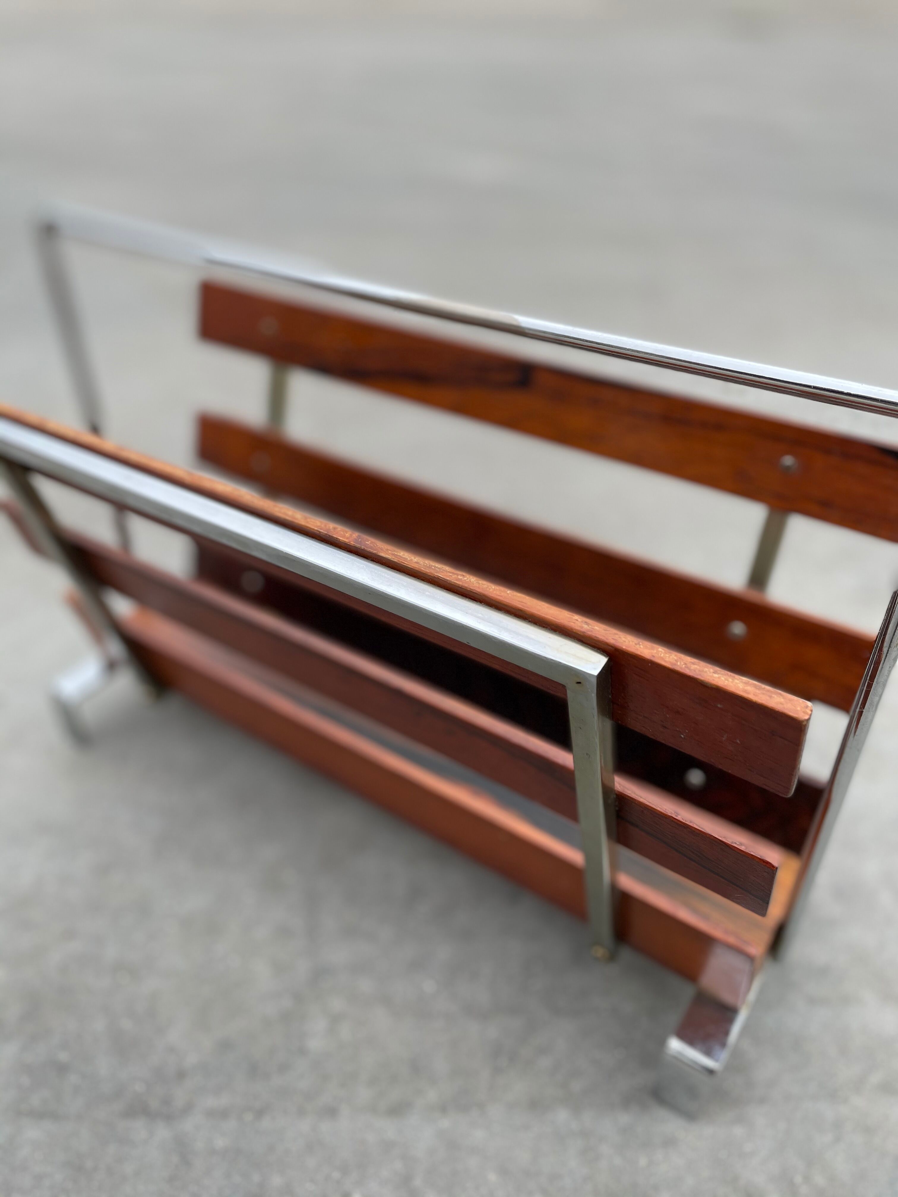 Vintage magazine rack from  rosewood and chrome design