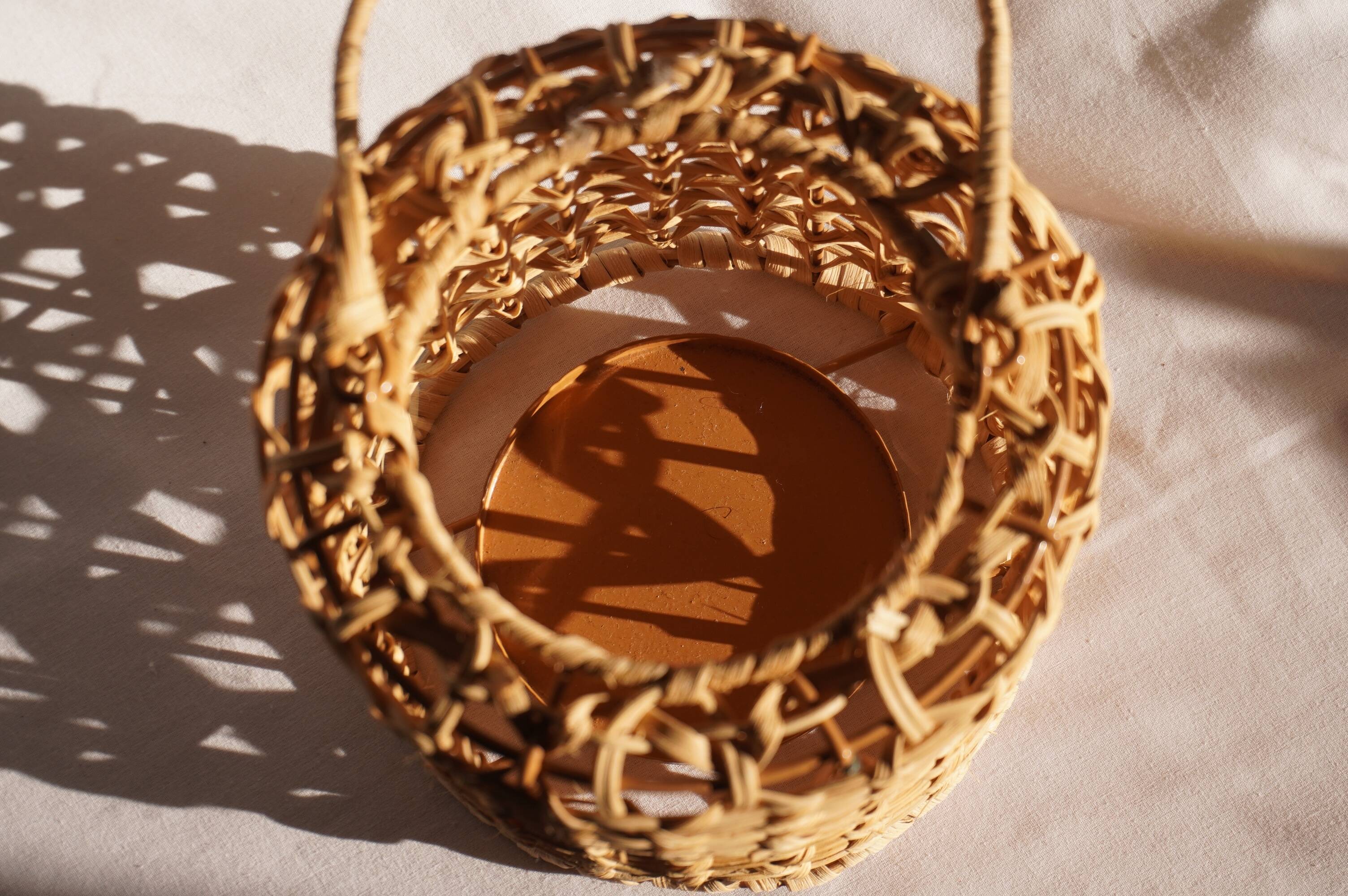 Wicker lantern / candle holder, metal frame