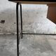 Black metal and wood mid-century industrial desk with laminated top and two drawers