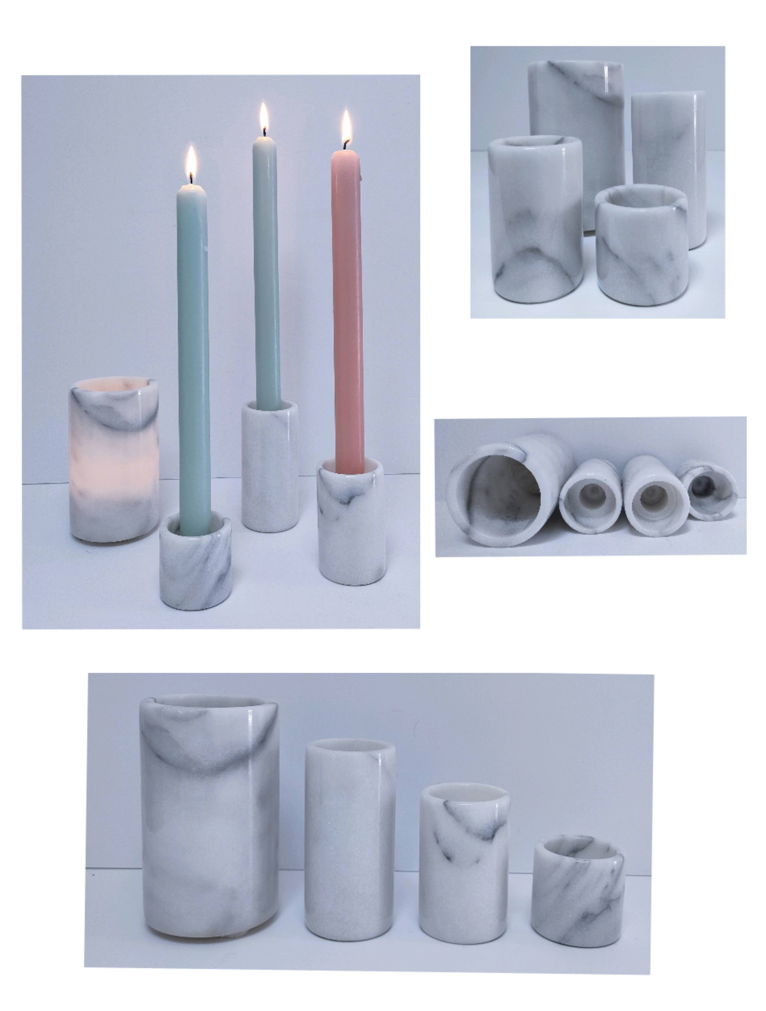 Four white marble candlesticks with black veins, 70s design