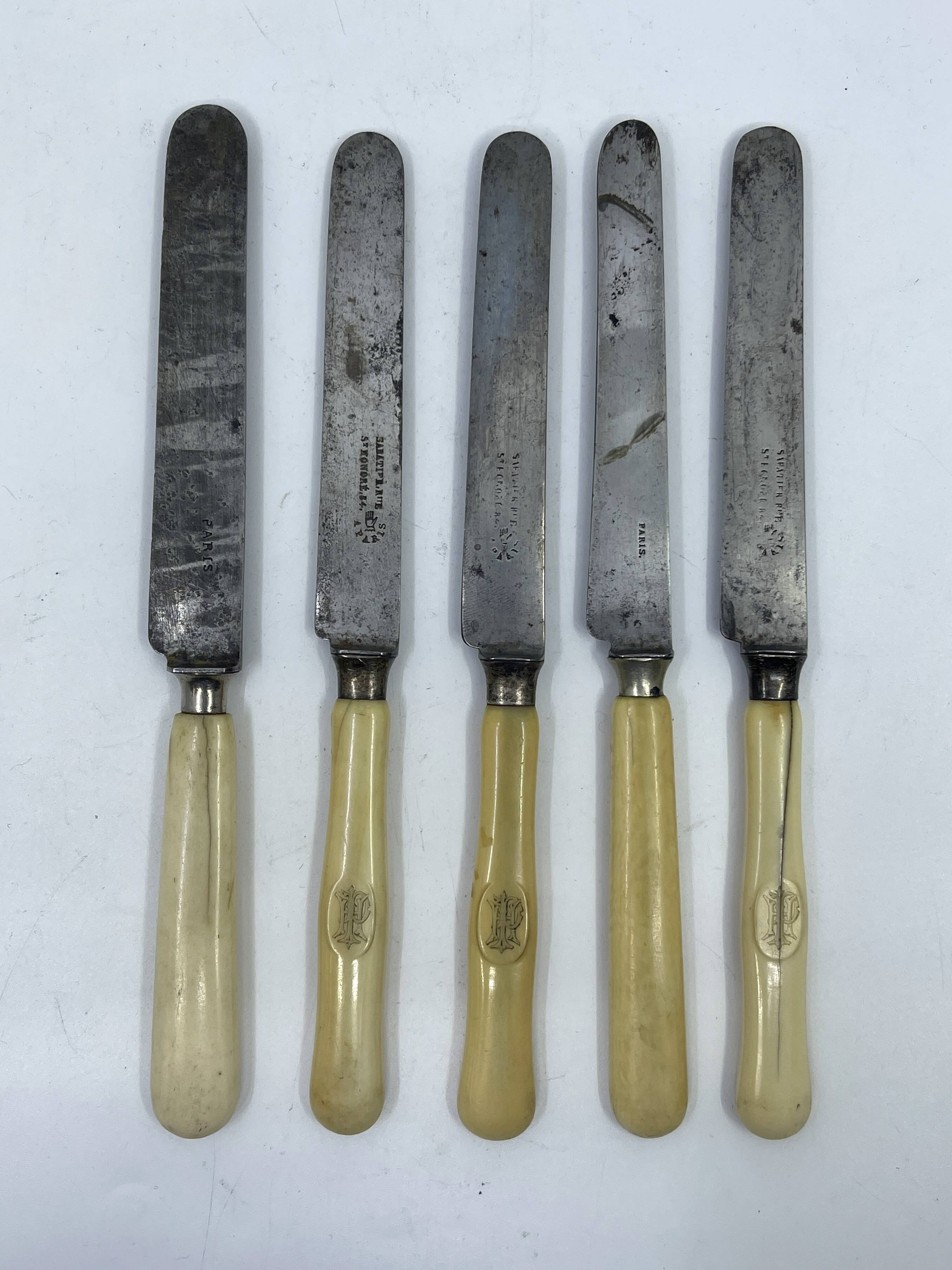 Set of 5 dessert knives with ivory handles.