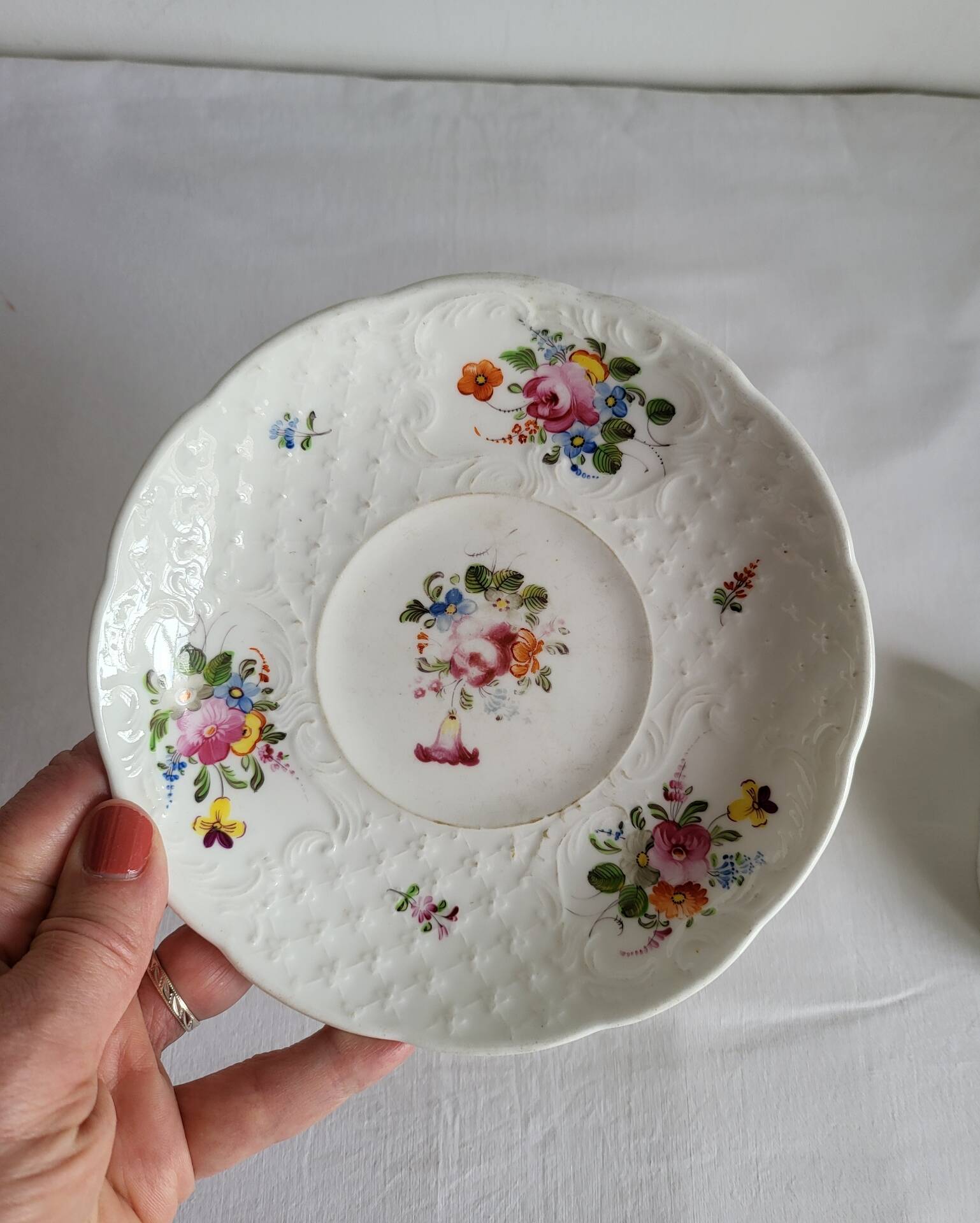 Antique Cup and Saucer in Porcelain with Hand-Painted Floral Decoration