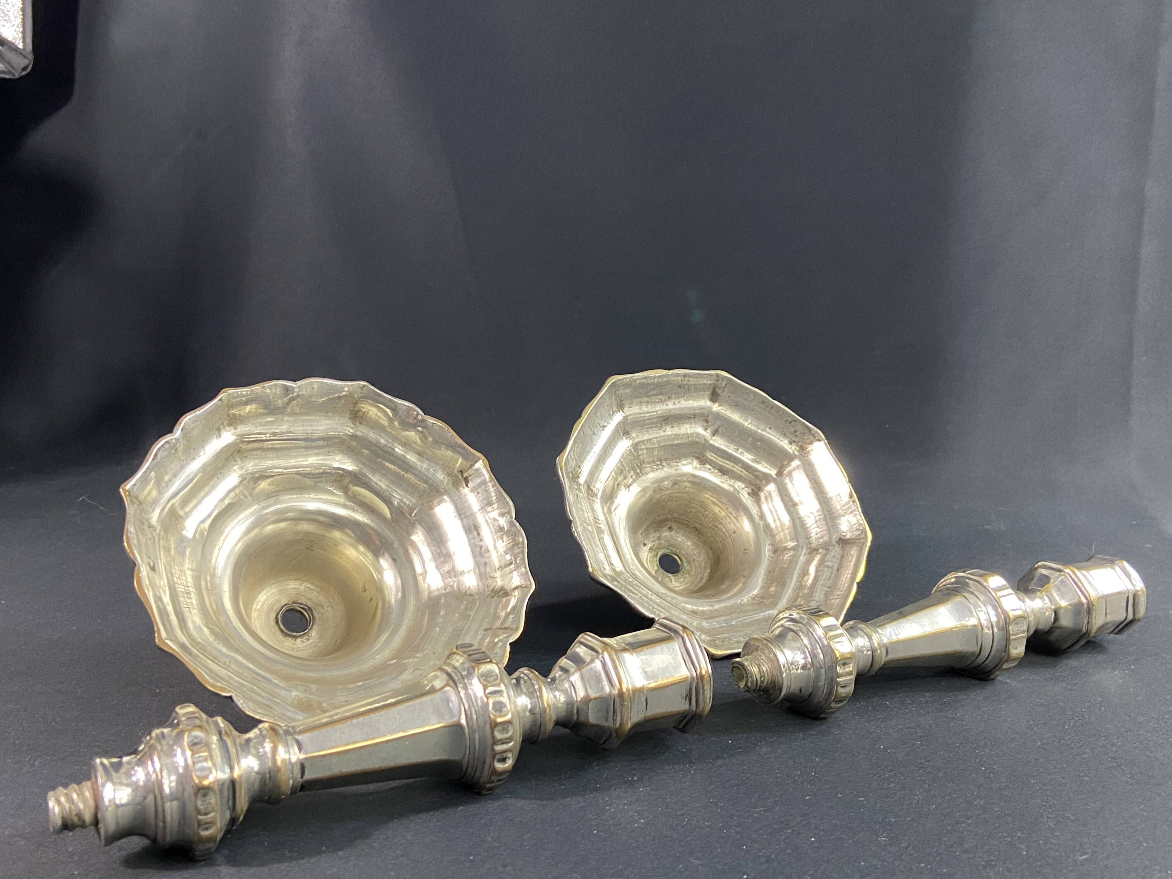 Pair of 18th century Regency candlesticks in silvered bronze