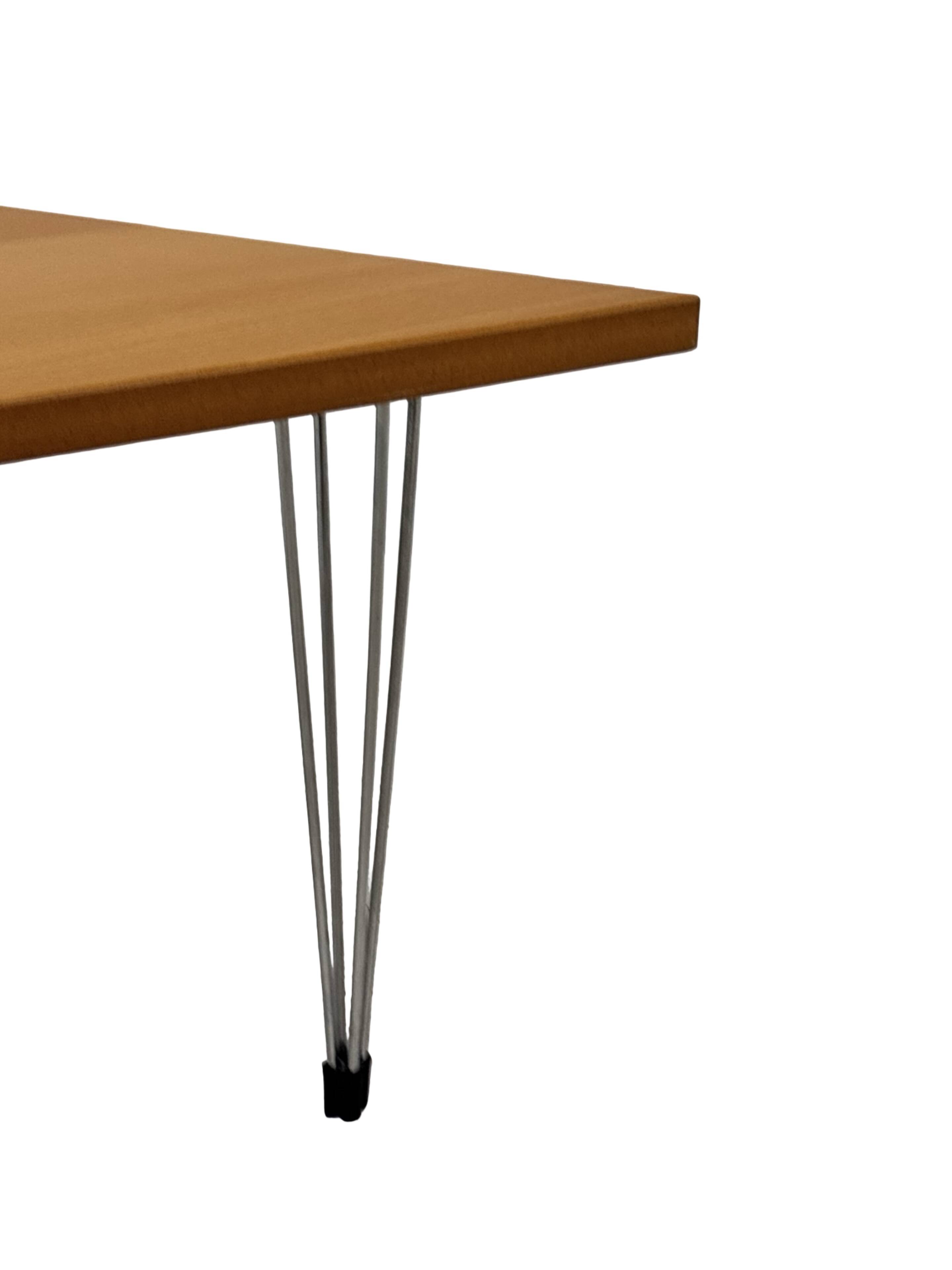 Vintage Danish triangular side table with hairpin legs design