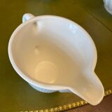 Old porcelain milk jug with barbel decoration