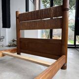 Brutalist style bed with chain and straw
