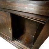 Vintage wooden display cabinet with sliding doors.