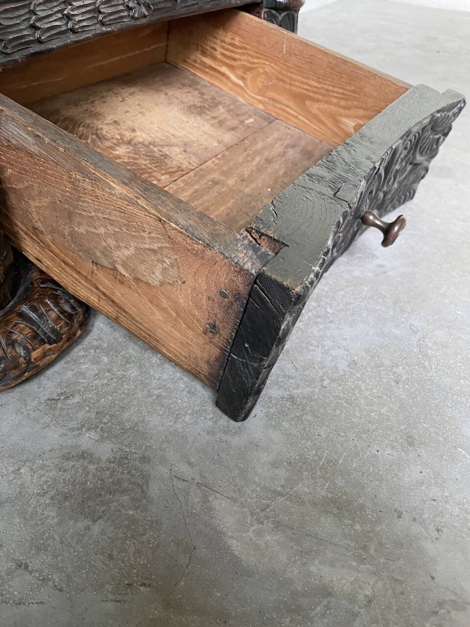 19th century chest of drawers in carved blackened pine