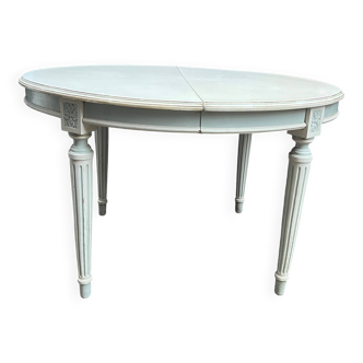 Louis XVI style table with extendable element.