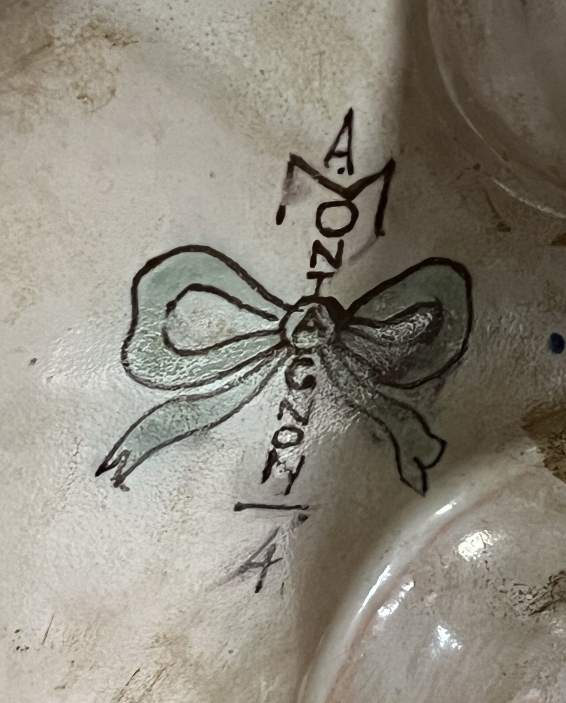 Earthenware planter with polychrome enamelled decoration on a blue background