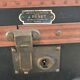 Old square travel trunk J Penet