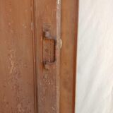 Old glazed door with its shutter