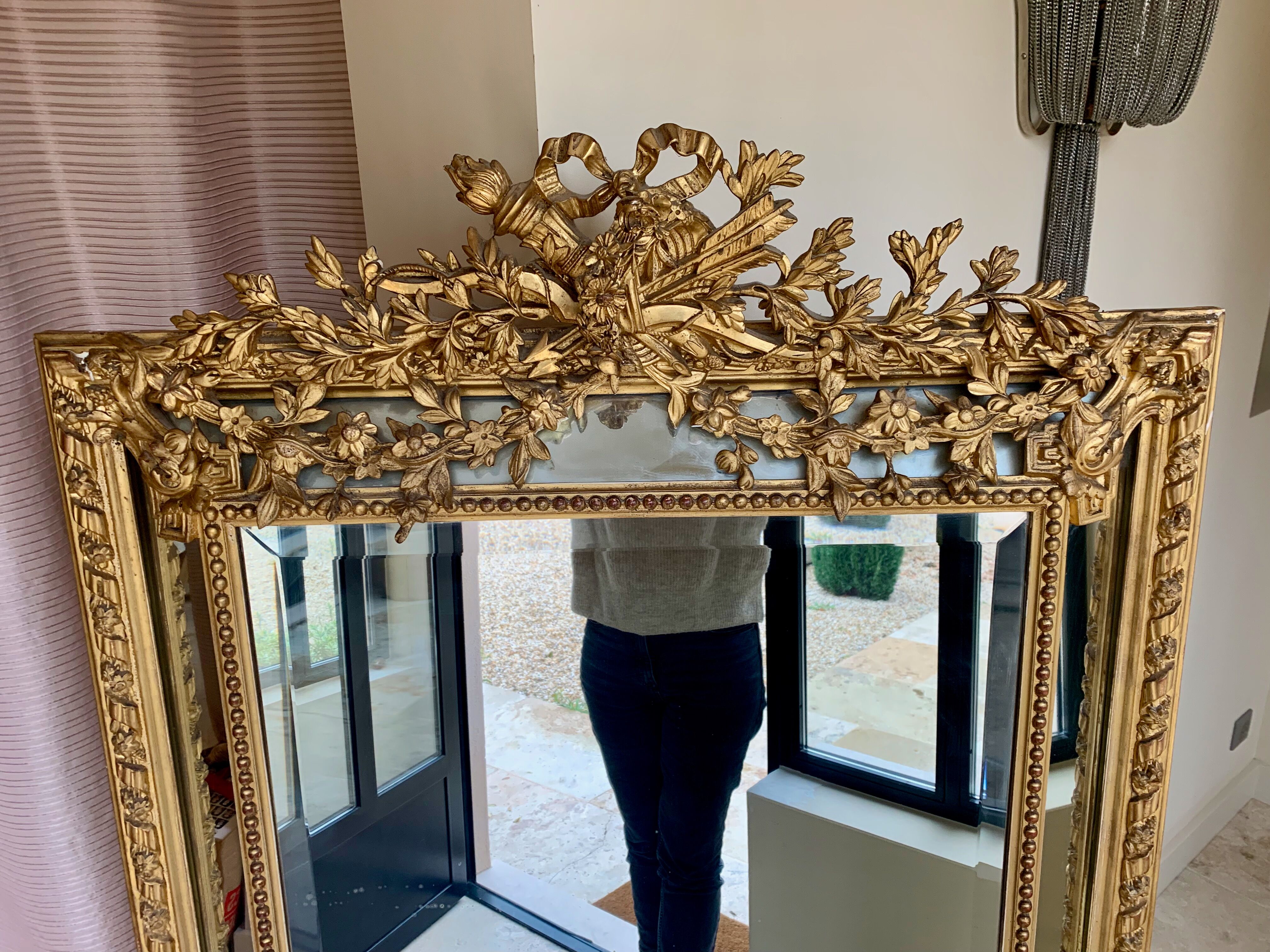 Large mirror style Louis XVI in gilded wood with parecloses xixth h: 165 cm
