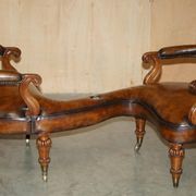 High Victorian leather tête-à-tête canapé with a walnut burr chessboard.