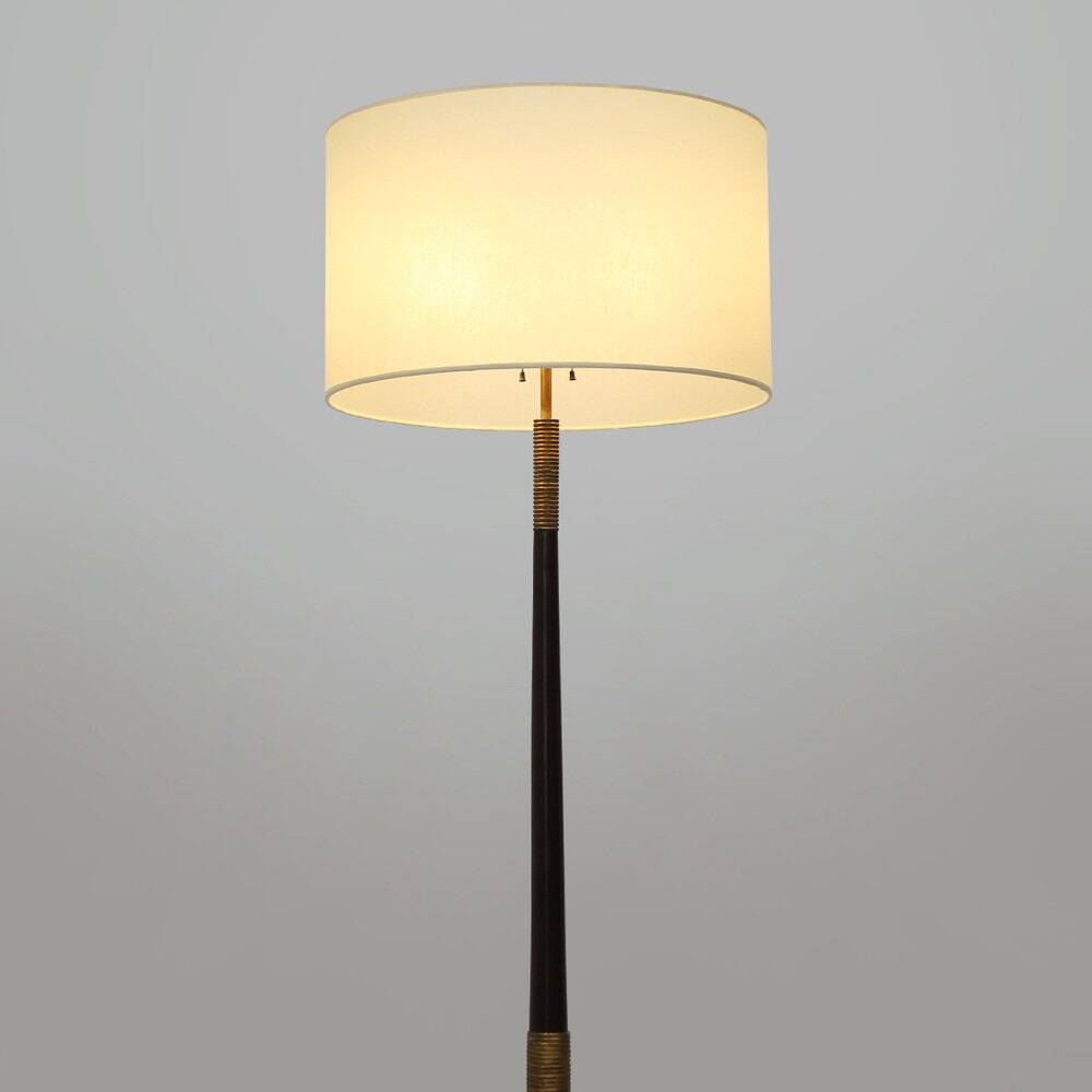 Floor lamp with a brass base and parchment shade, 1940s.