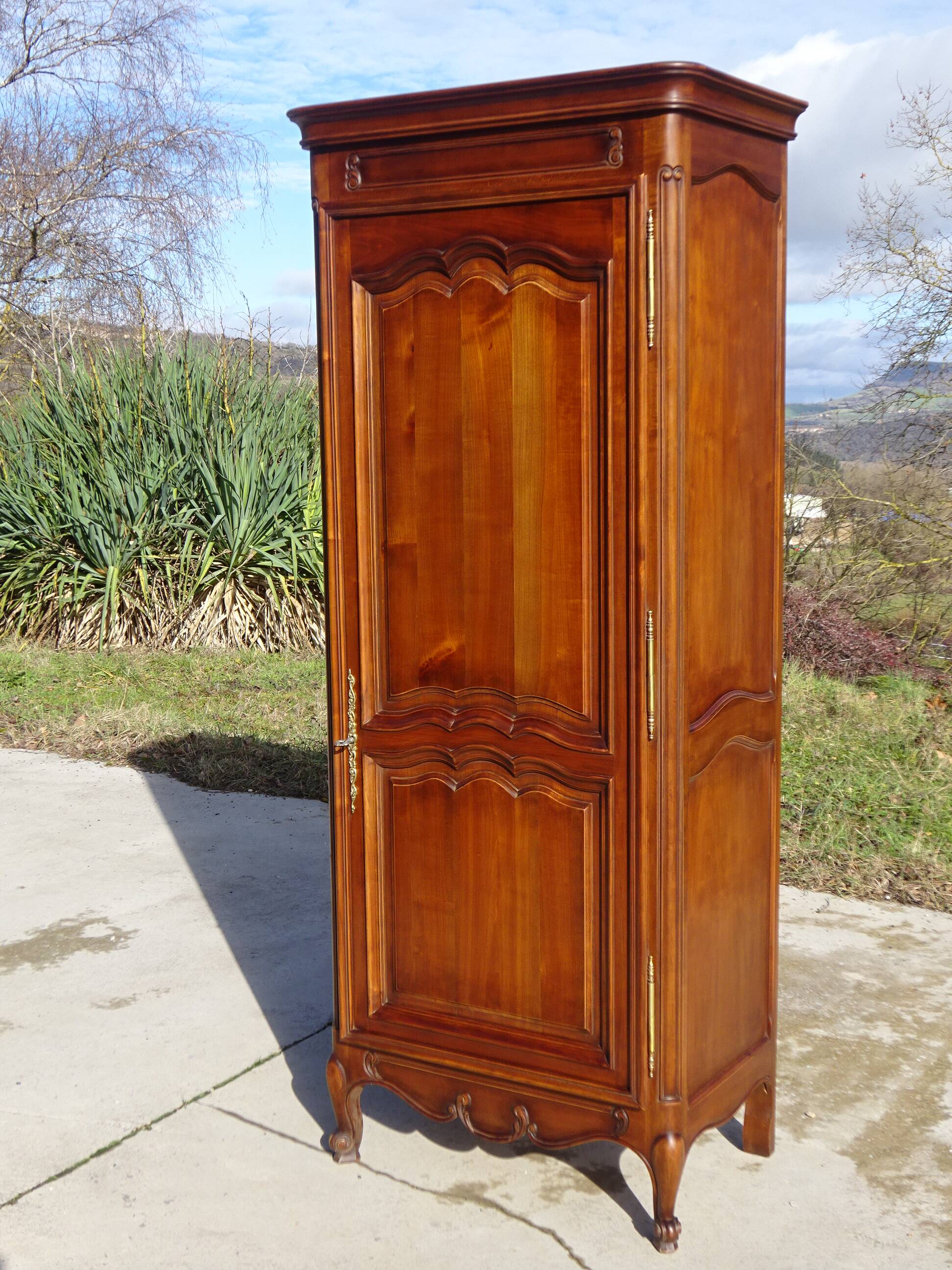 Louis XV style bonnetière in solid cherry wood