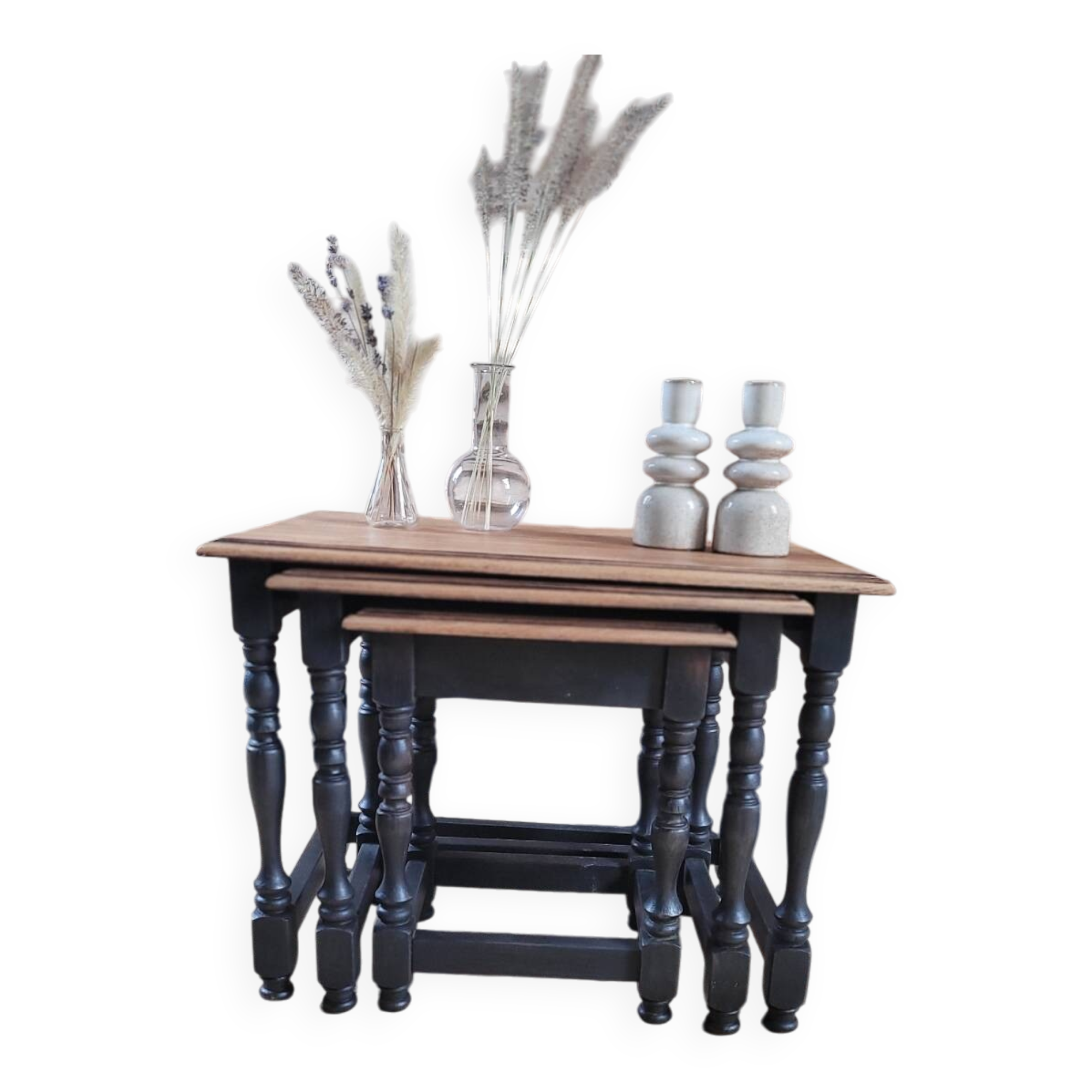 Nest tables in wood and black.