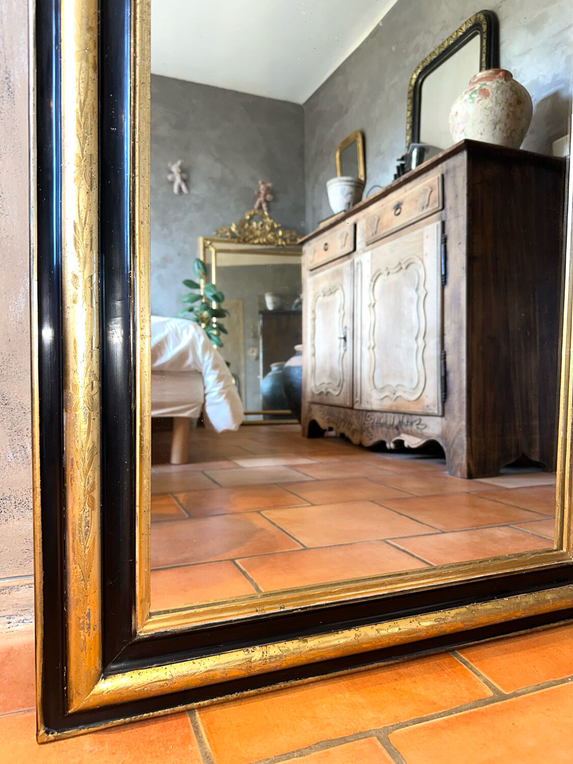 Louis-Philippe black and gold antique mirror from the 19th century