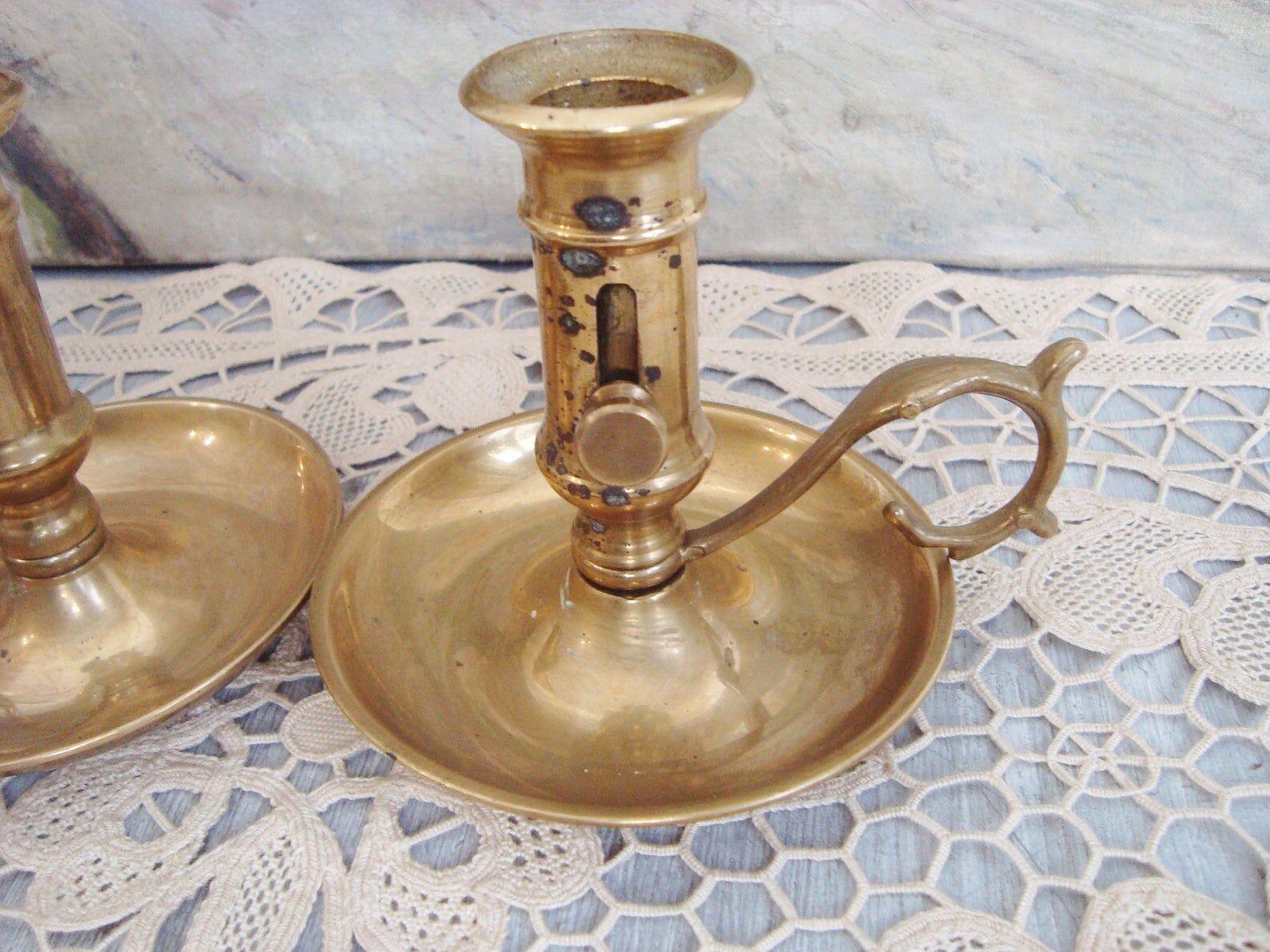 Pair of brass cellar rat candlesticks
