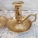 Pair of brass cellar rat candlesticks