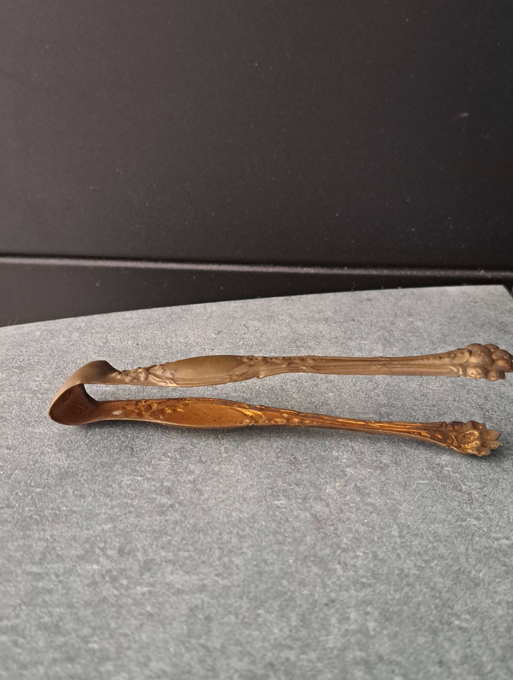 Antique sugar tongs with a system - Lion claws and Louis XV bow decoration.