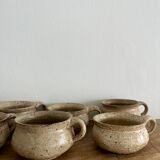 6 stoneware cups and saucers