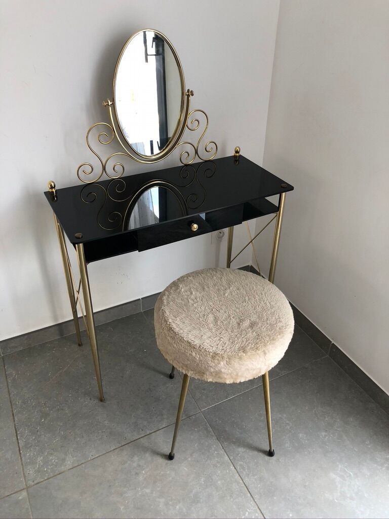 Brass hairdresser, glass and black plastic with its fluffy stool.