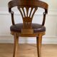 Vintage office chair in wood and brown studded leather late nineteenth