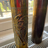 Gourd and vase in shell casing