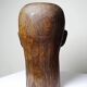 Monoxyle wood sculpture of a man's head, vintage craftsmanship from the 1950s.