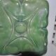 Green enamelled ceramic stove tile — finely sculpted Hungarian pattern from the late 19th century.