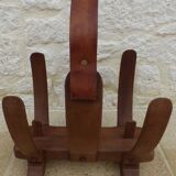 Unique piece of a magazine rack or log rack in solid oak pegged with leather handle