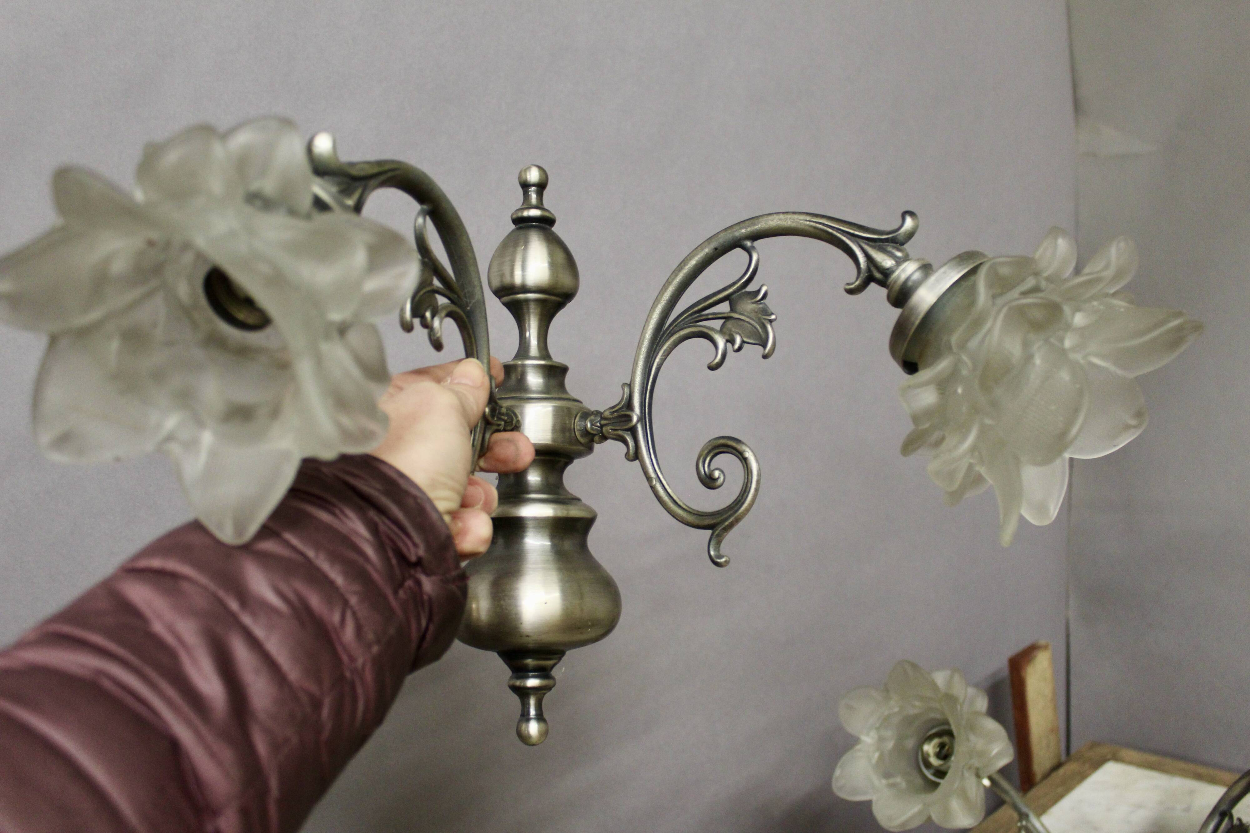 Pair of wall sconces with 2 light arms