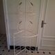 Cream and brass corner bakery shelf in wrought iron