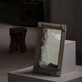 Wall mirror in tramp art style, hand-carved with a painted white frame, early 1900s.