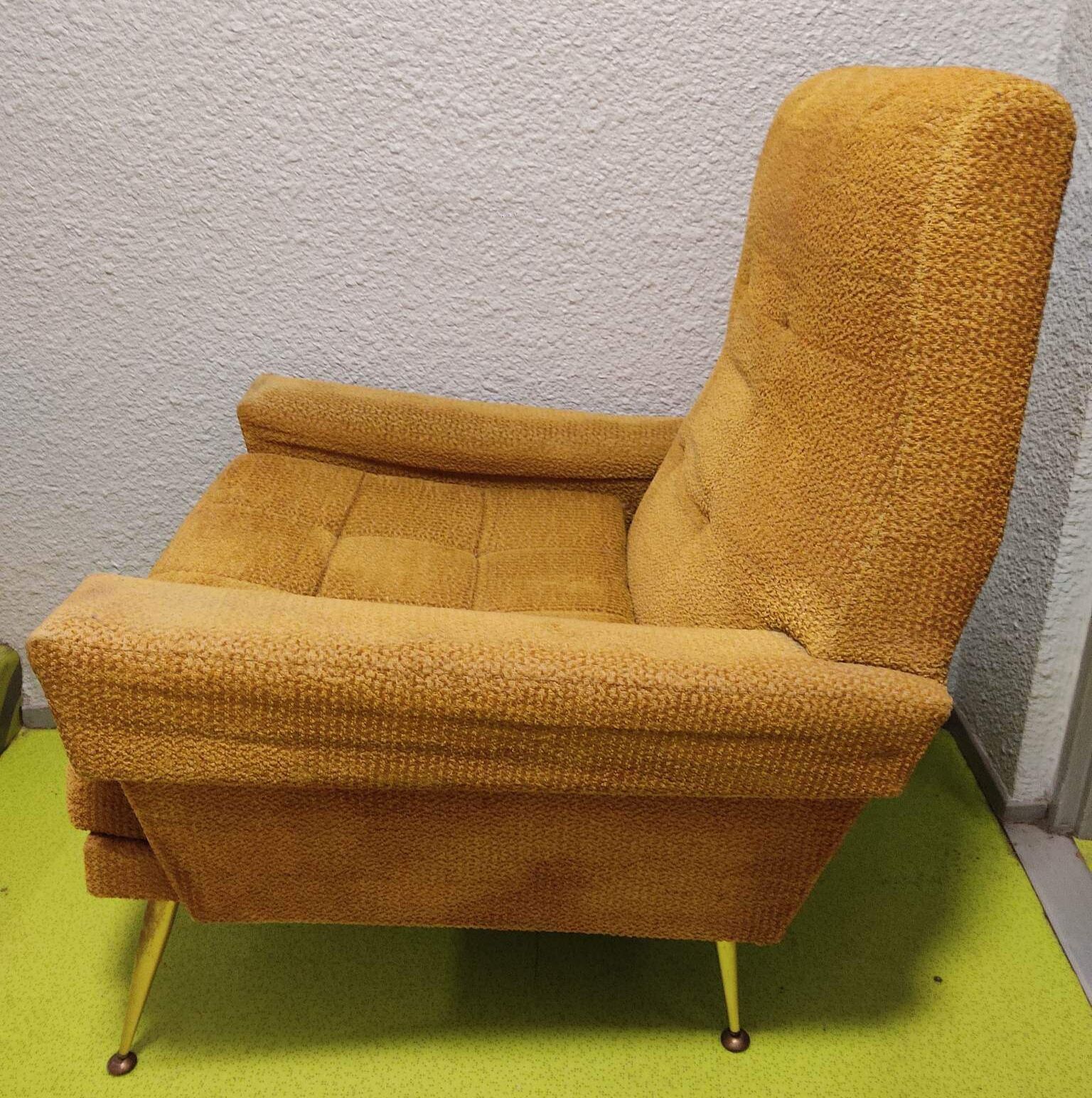 Old velvet heating chair on metal legs