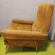 Old velvet heating chair on metal legs