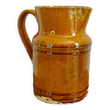 Pichet ancien en faïence française à glaçure orange