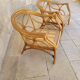 Two large rattan armchairs