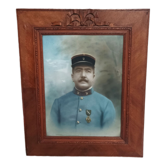 Old wooden frame and knot carved with portrait