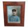 Antique wooden frame with carved portrait knot