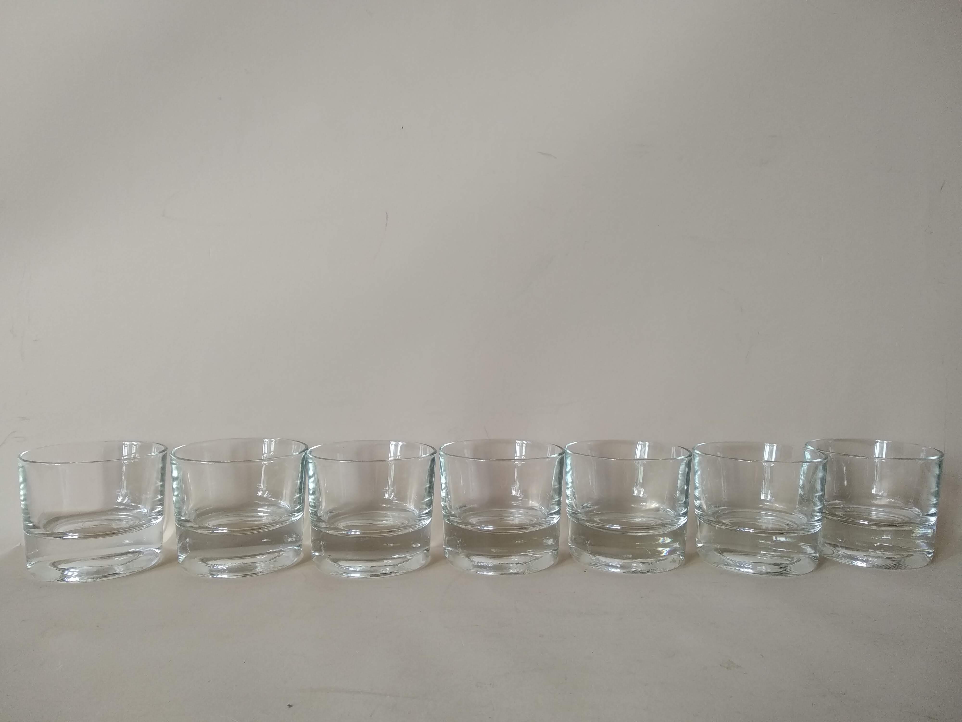 Glasses cups with thick bottom with water or vintage spirits 70