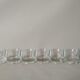 Glasses cups with thick bottom with water or vintage spirits 70