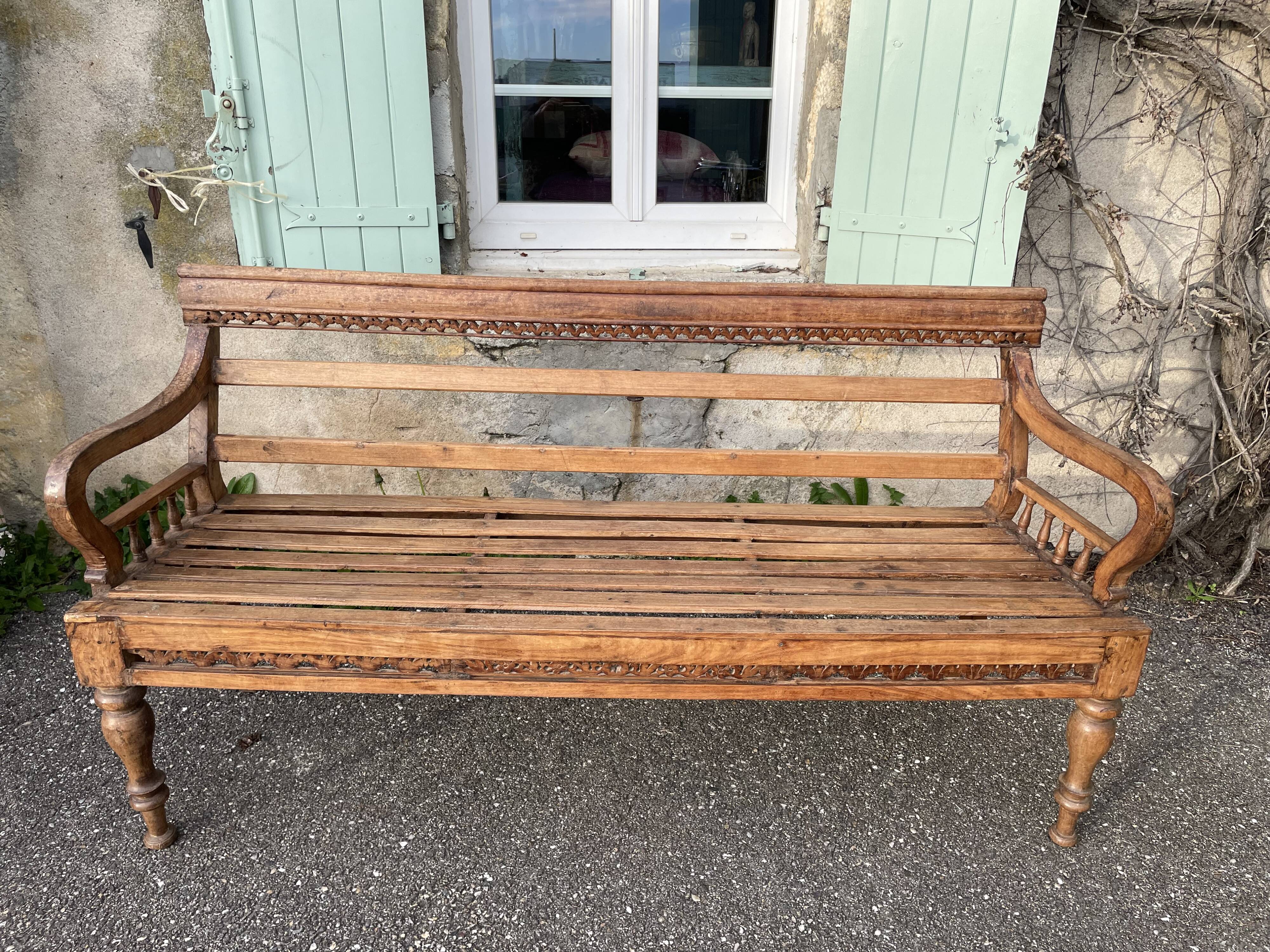 Carved teak bench