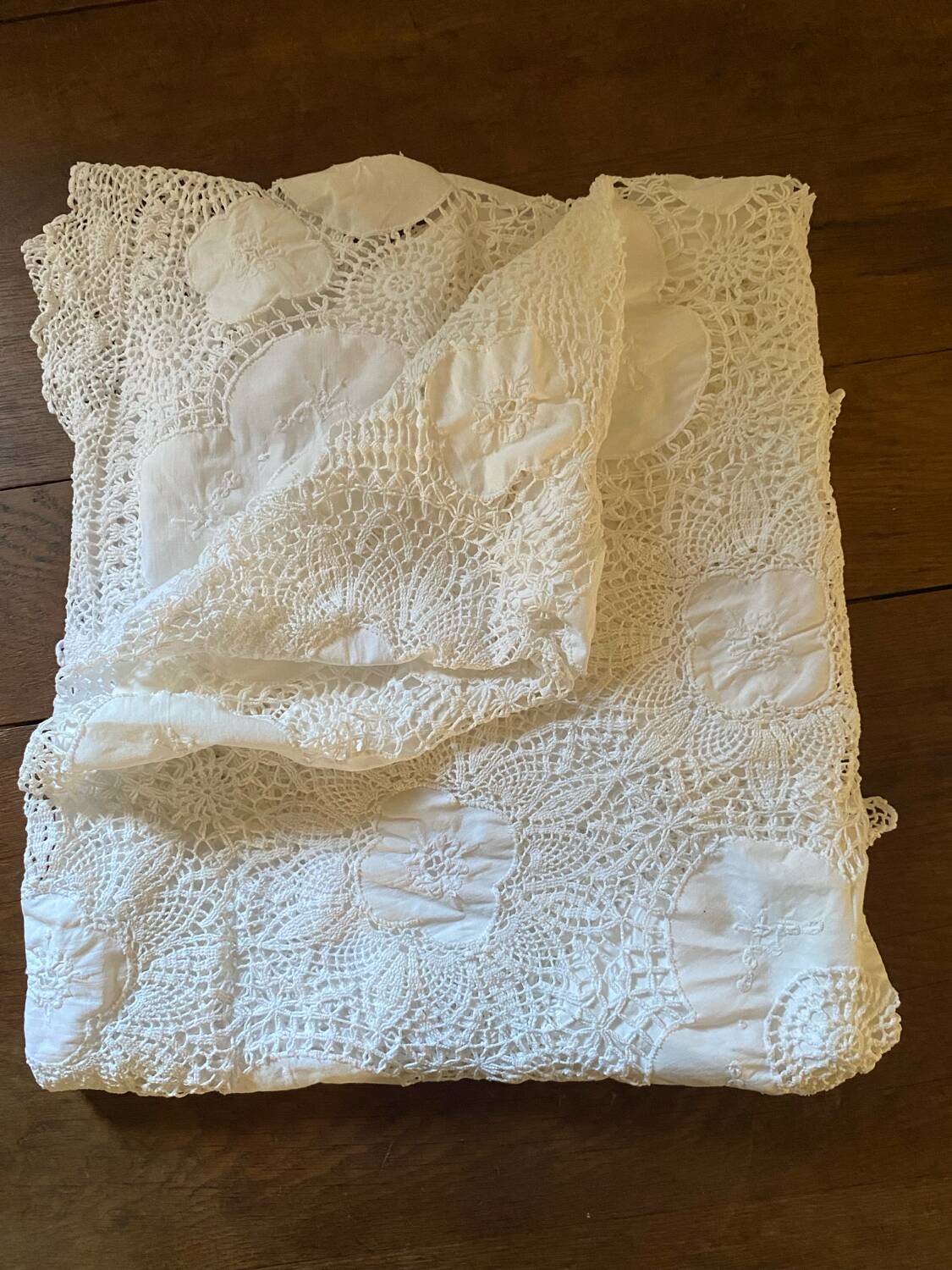 White cotton tablecloth with crochet lace.